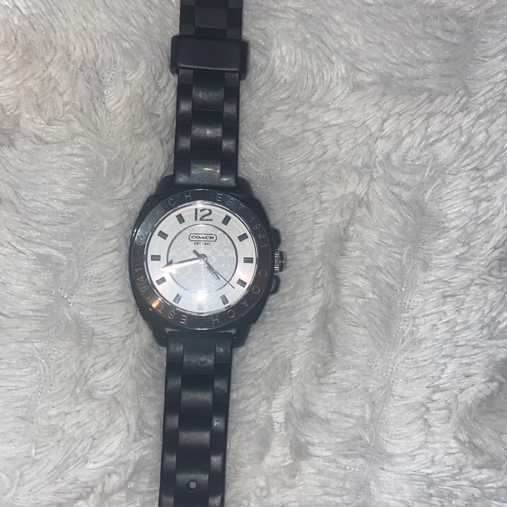 Like new black and silver women’s Coach watch
